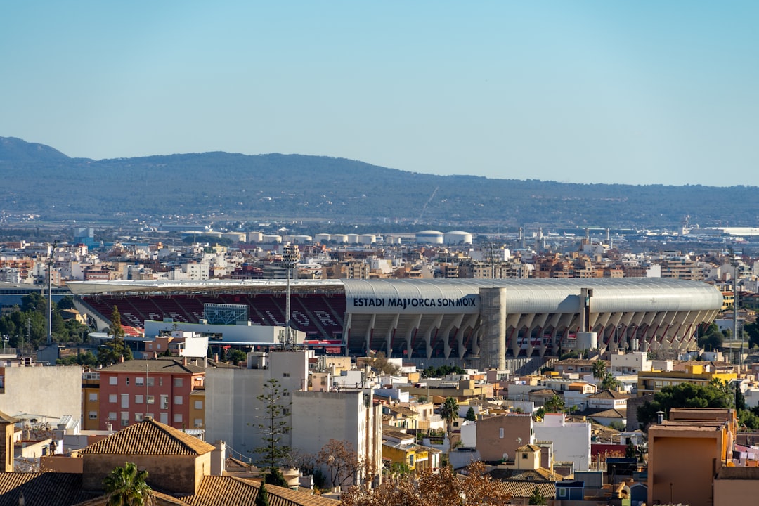 a view of a city with mountains in the background girona players, spanish football, la liga stadium