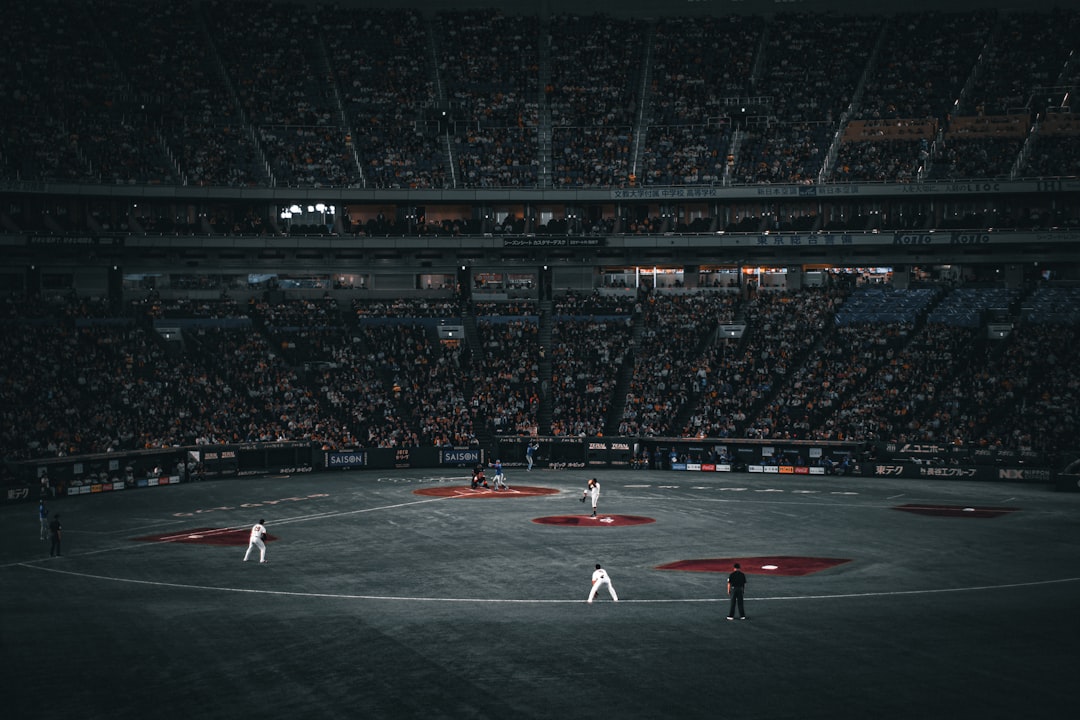 Baseball players on field during a game tokyo dome, yomiuri giants, japanese baseball fans