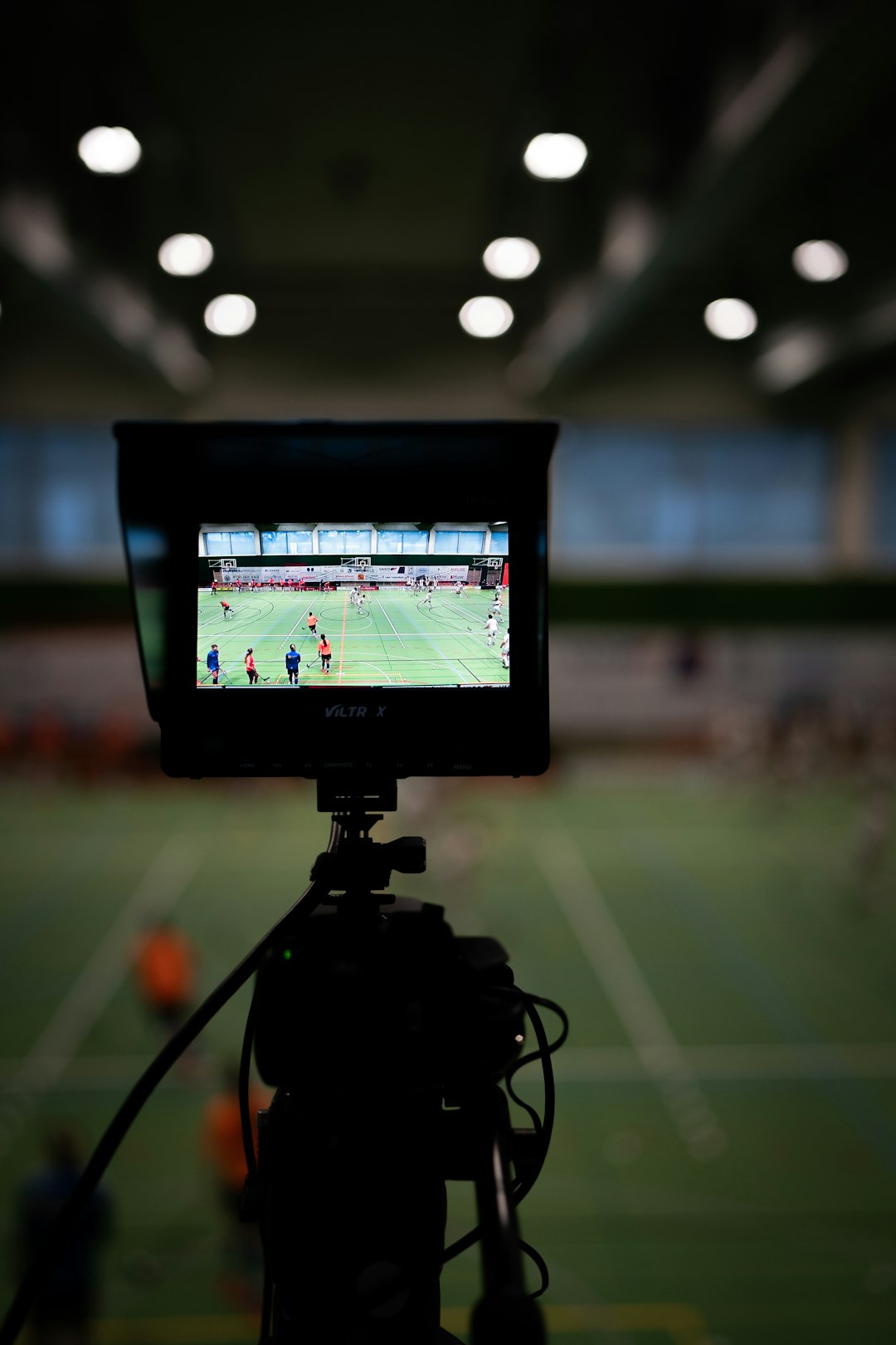 black dslr camera taking picture of a building watching film, football analysis, fantasy scouting
