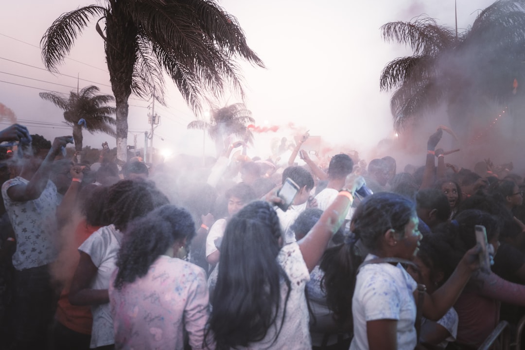 people gathering on street during daytime miami fans, heat jersey, tailgate party
