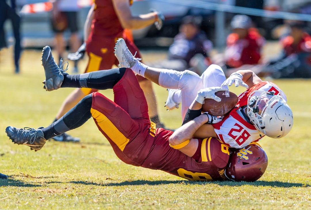 people playing football during daytime stanford football, edge rusher action, quarterback sack