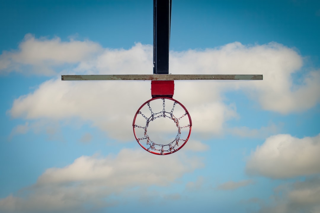 a basketball hoop hanging from the side of a basketball hoop faith in sports, religious athletes, nba faith