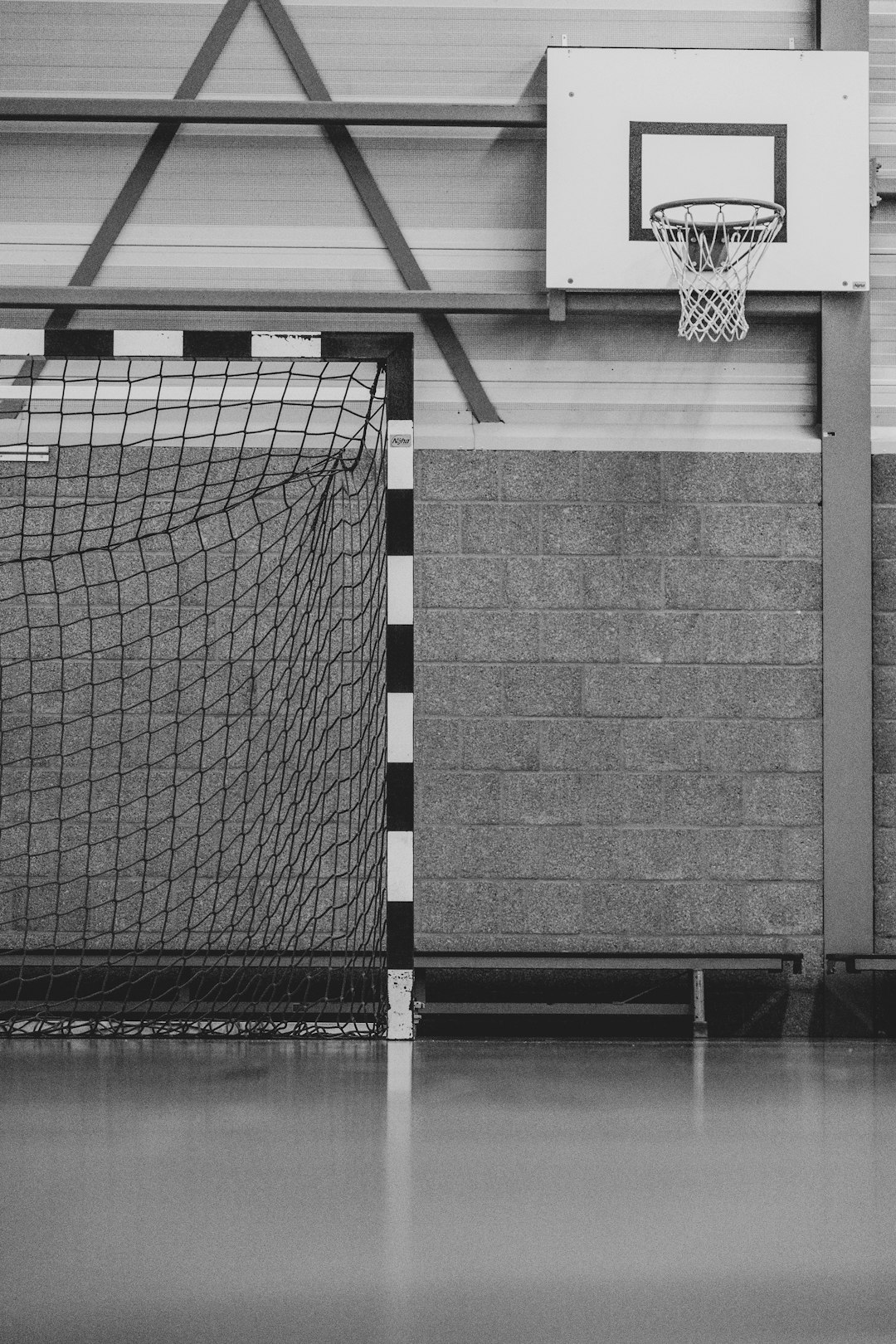 a basketball hoop in a room volleyball injury substitution bench players