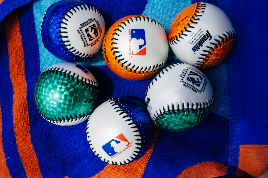 a group of baseballs sitting on top of a towel international softball, olympic softball, global teams