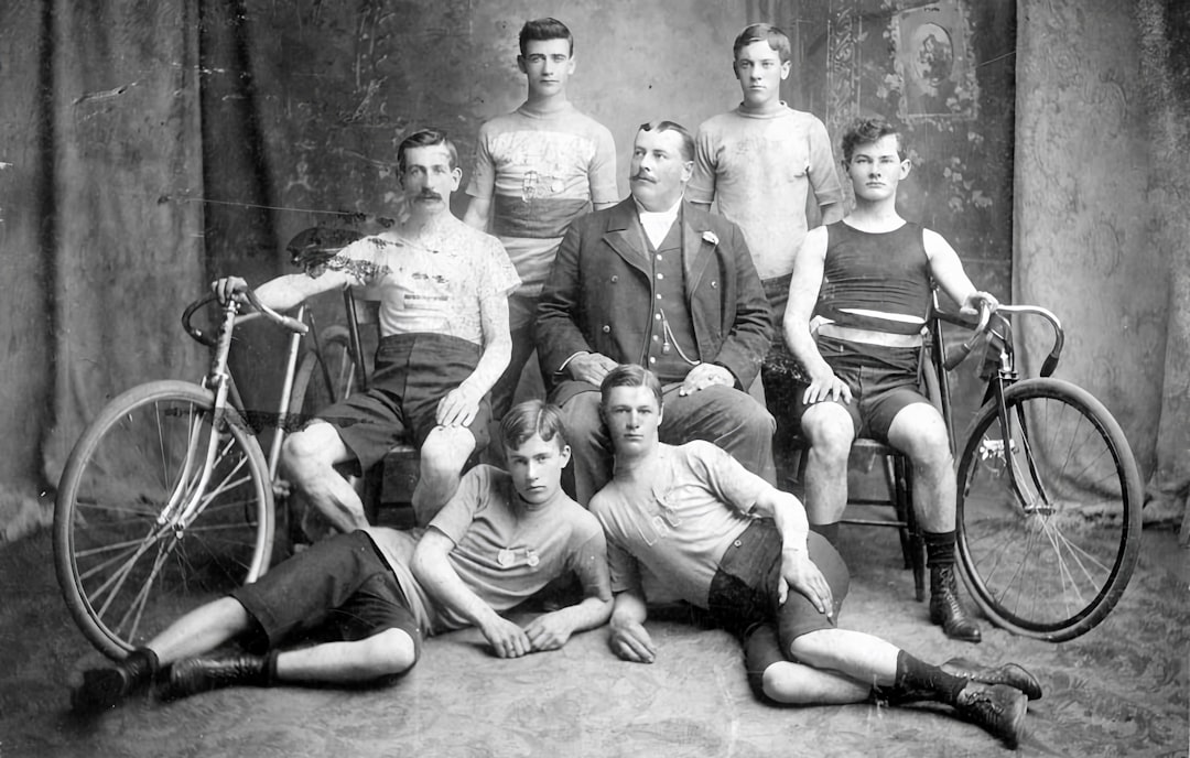 a group of men sitting next to each other lacrosse olympics field team sport