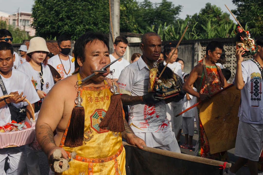 a group of people standing around each other muay thai, thailand, traditional fight