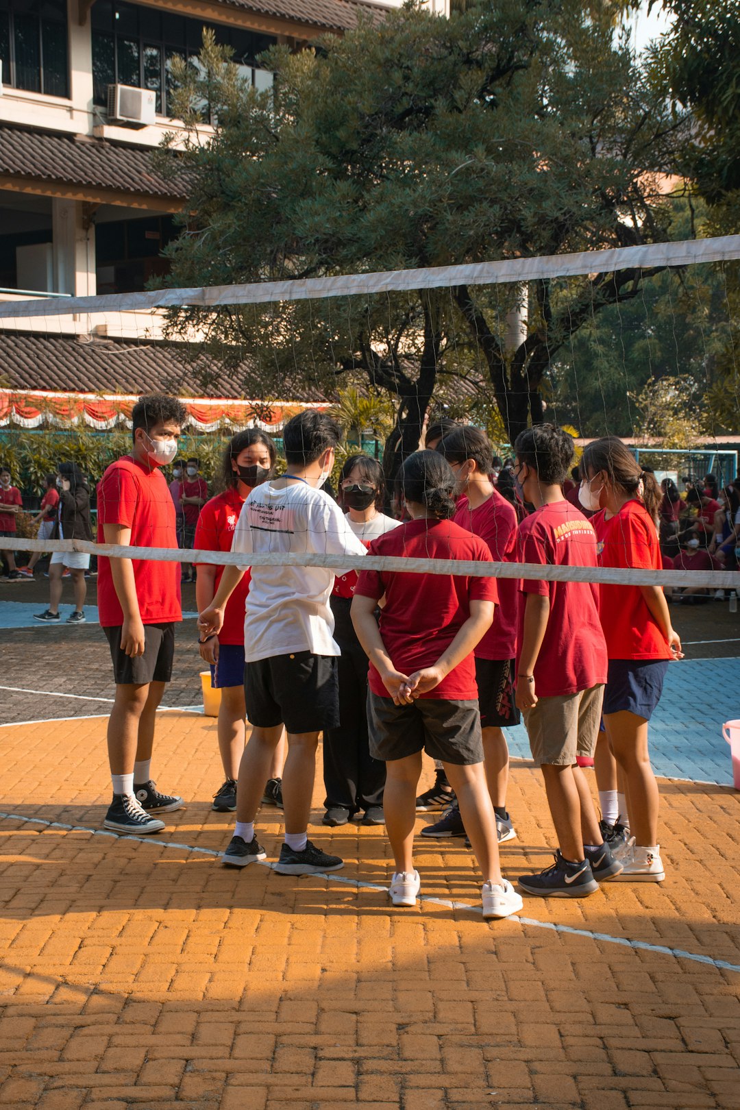 a group of people standing together teamwork volleyball positions indoor court