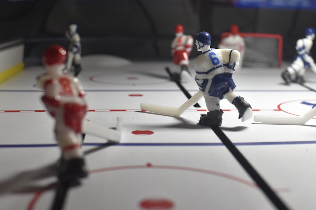 A tabletop hockey game is being played. youtube tv dvr, sports streaming, watching hockey at home