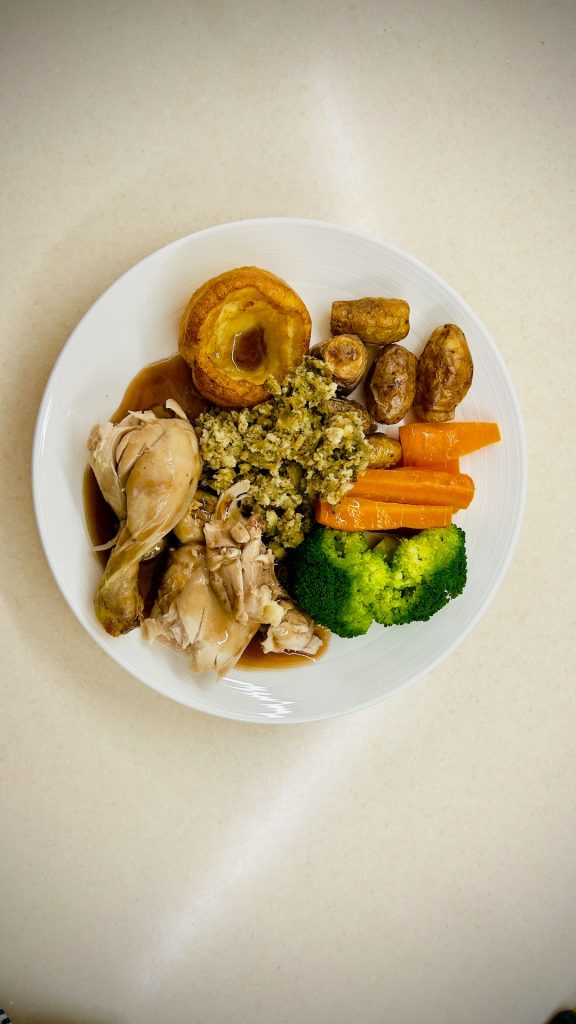 A white plate topped with different types of food football meal prep, healthy bulk eating, protein packed food