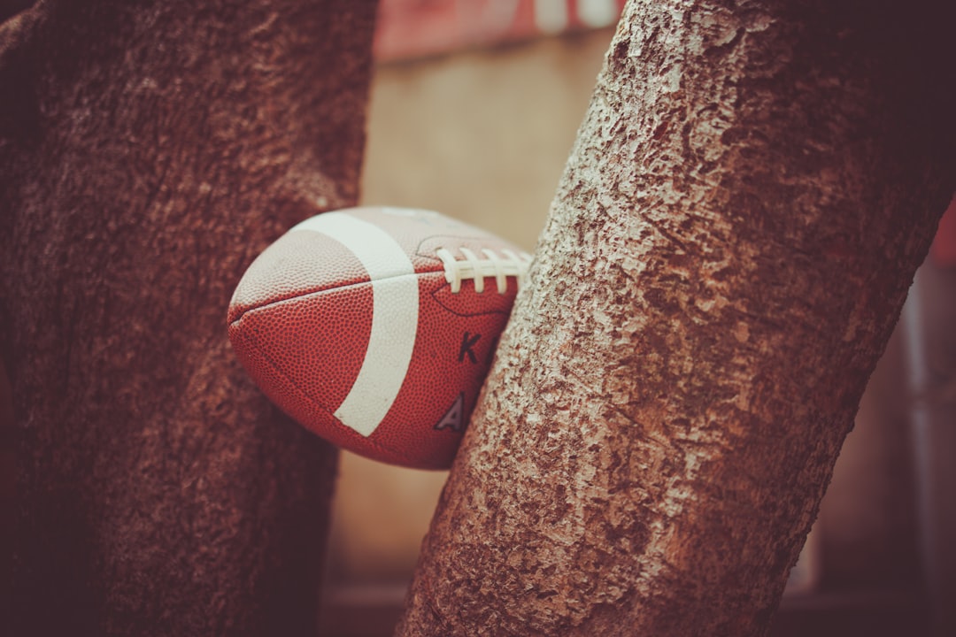 Football sits between two trees. flag football, nfl stars, pro bowl