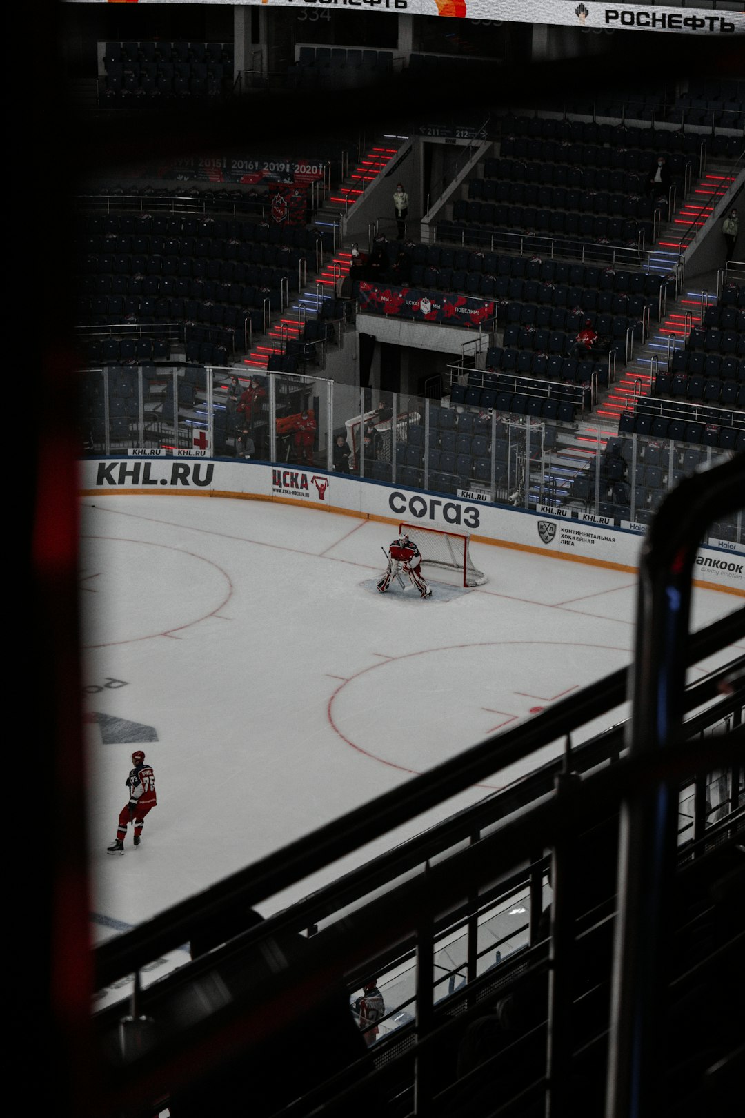 ice hockey players on ice hockey stadium empty seats, struggling hockey team, arena issues