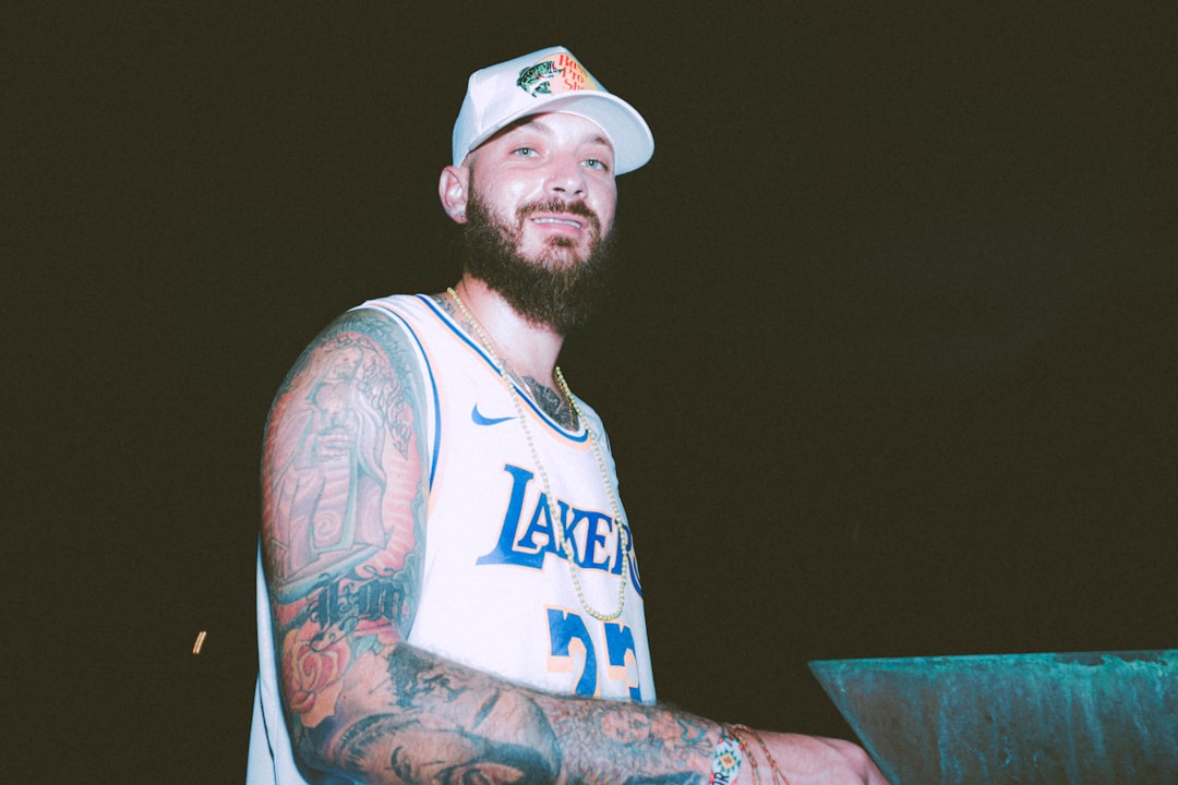 man in white and blue tank top wearing white and red fitted cap lebron james, farewell, spotlight, nba fans