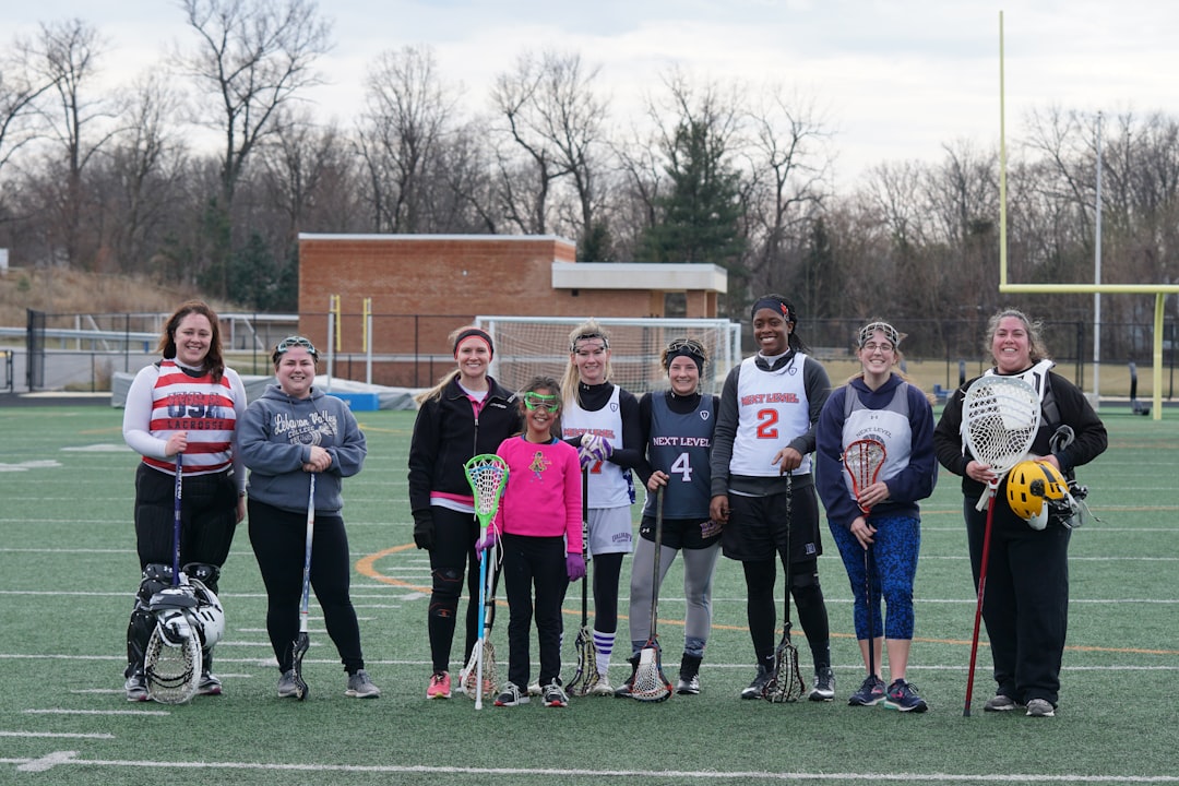 people standing on american football field lacrosse olympics field team sport