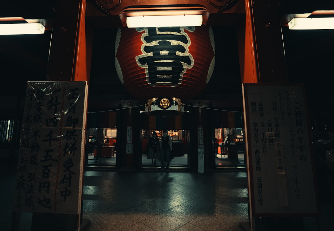the entrance to a building with oriental writing on it muay thai fighter, japan, ring match