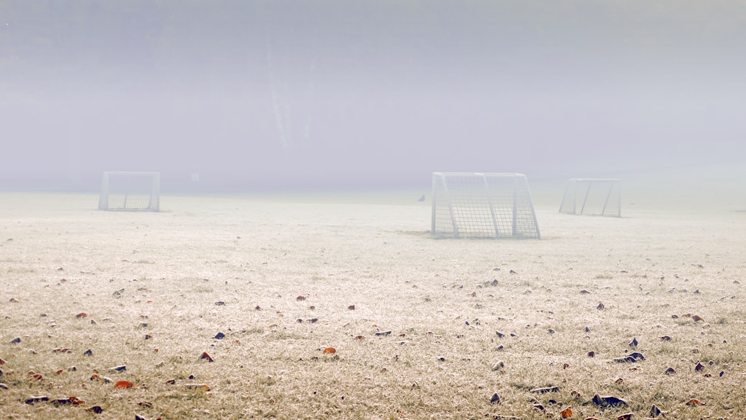 white and blue beach chairs on beach shore during daytime football weather delay rain thunderstorm stadium