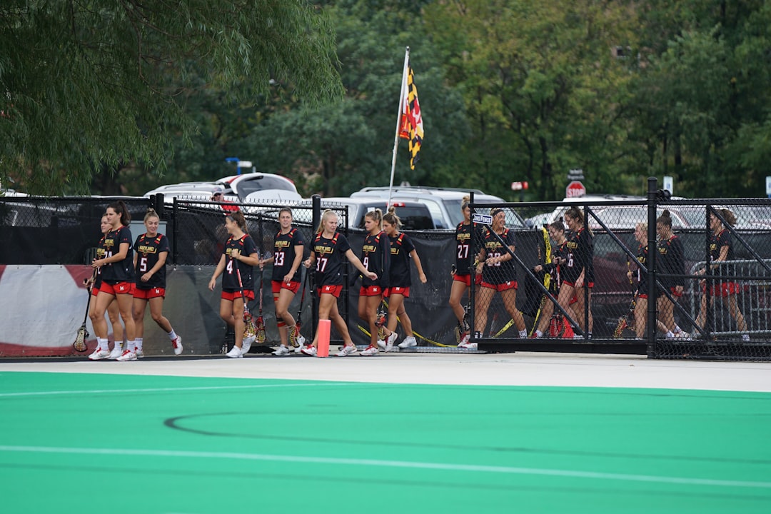 women marching while holding flag lacrosse olympics field team sport