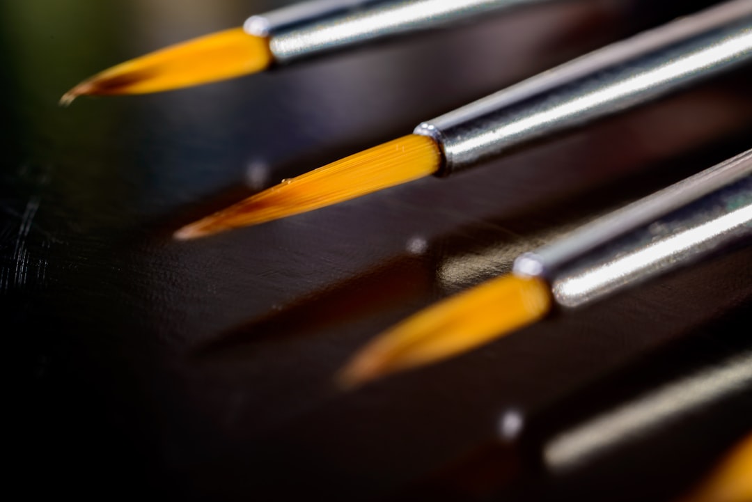 a close up of a black and yellow pencils vinyl stylus closeup, cleaning stylus, needle care