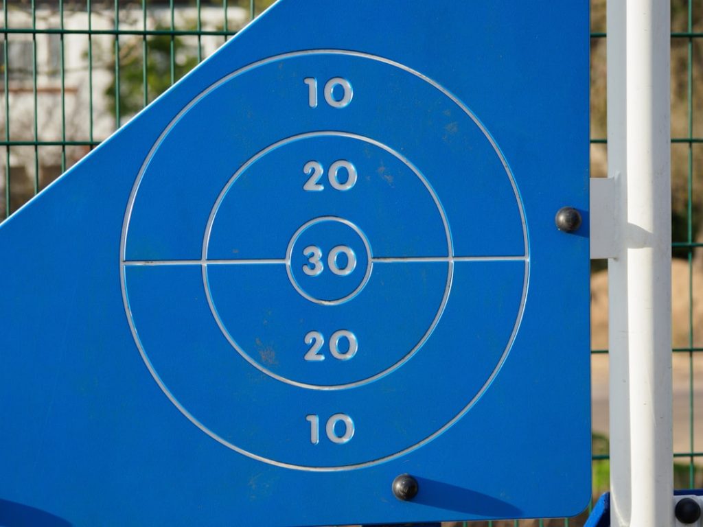 a close up of a blue sign with numbers on it skeet field layout, clay targets, shooting range