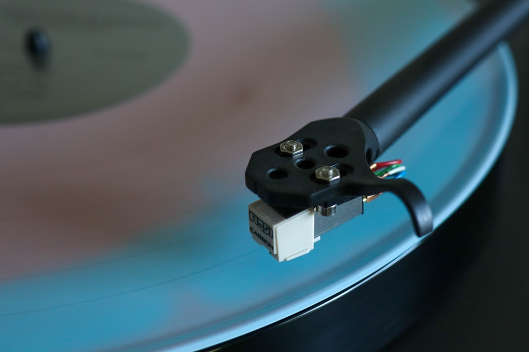A close up of a record player's turntable vinyl stylus closeup, cleaning stylus, needle care
