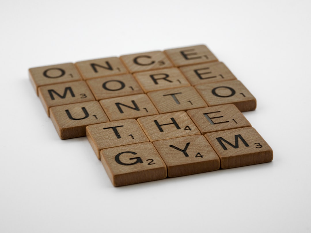 a couple of scrabble tiles sitting on top of a table sports fan gym, tv sports, home workout