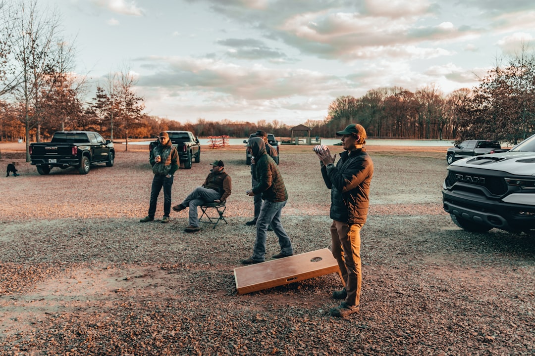 a group of people outside beginner shooting lesson, shotgun stance, clay shooting technique