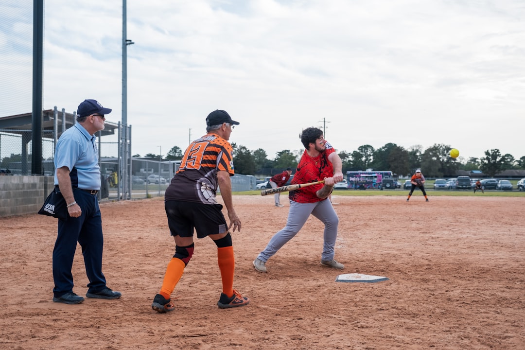 A group of people playing a game of baseball baseball umpire strike zone calls