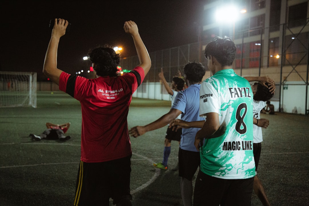a group of people standing on top of a soccer field calleri goal celebration bragantino defender