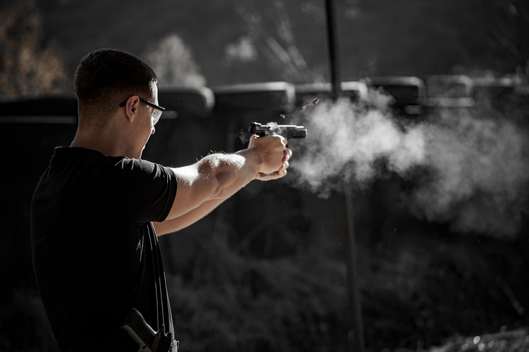 A man holding a gun with smoke coming out of it beginner shooting lesson, shotgun stance, clay shooting technique