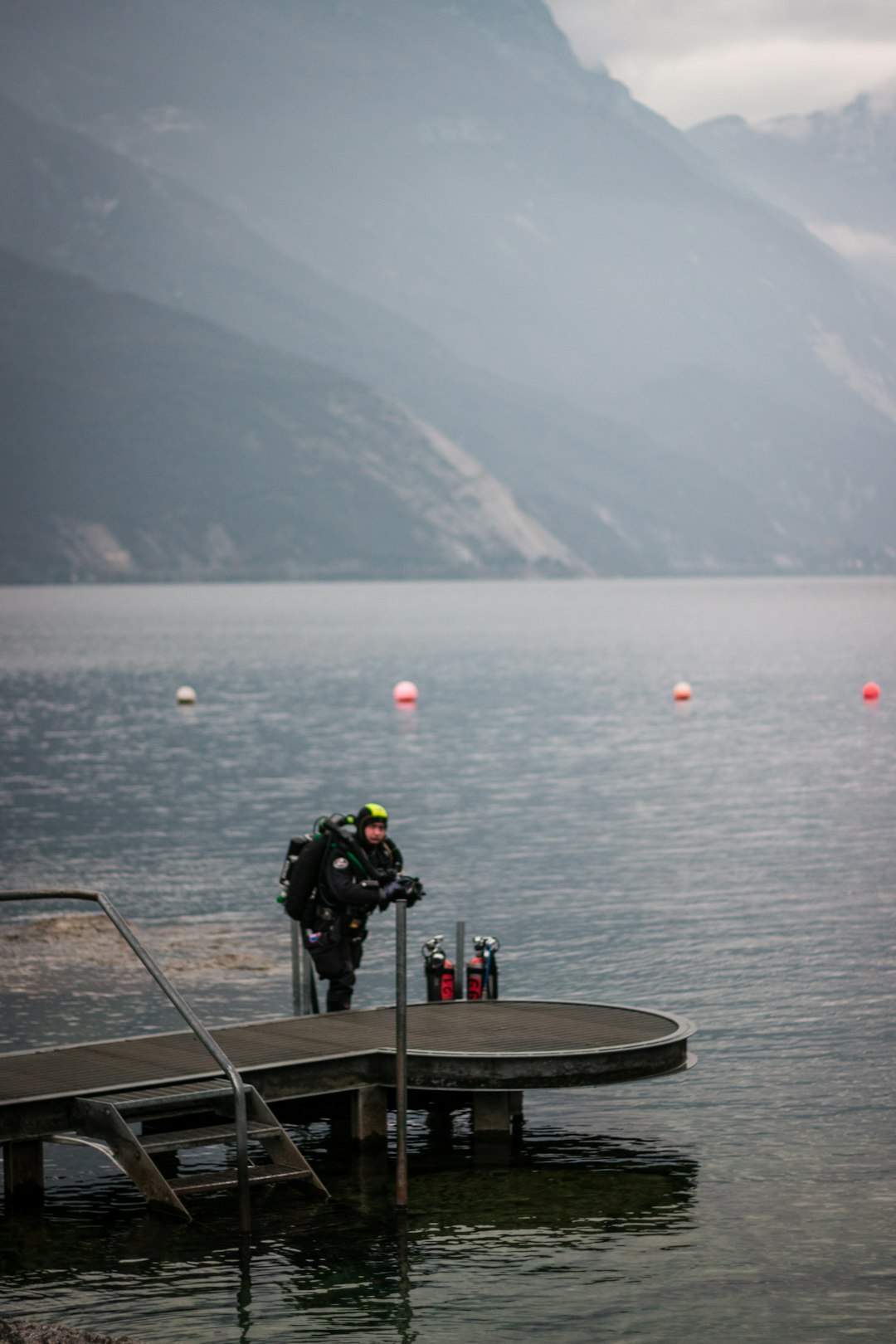 a person standing on a dock water ski group safety boat communication signals
