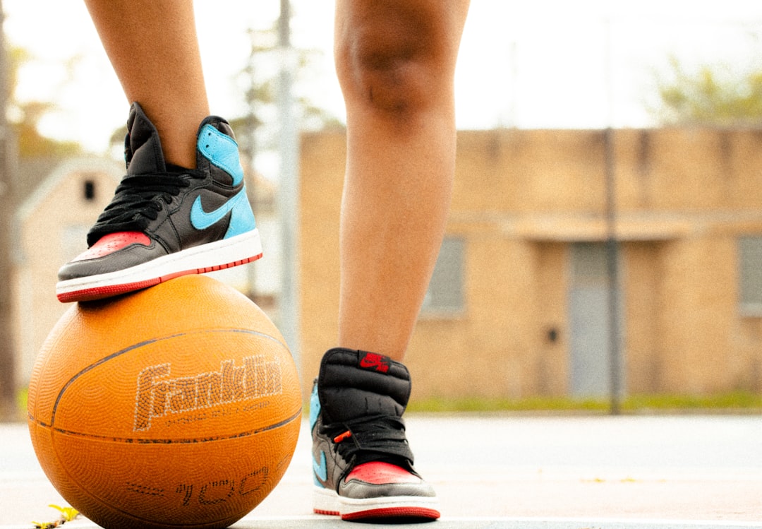 a person's legs and feet basketball shoe contract signing, sports sponsorship deal, athlete commercial shoot