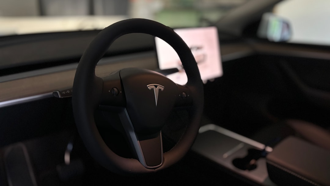 A tesla's steering wheel and interior. tesla pentagon technology ev