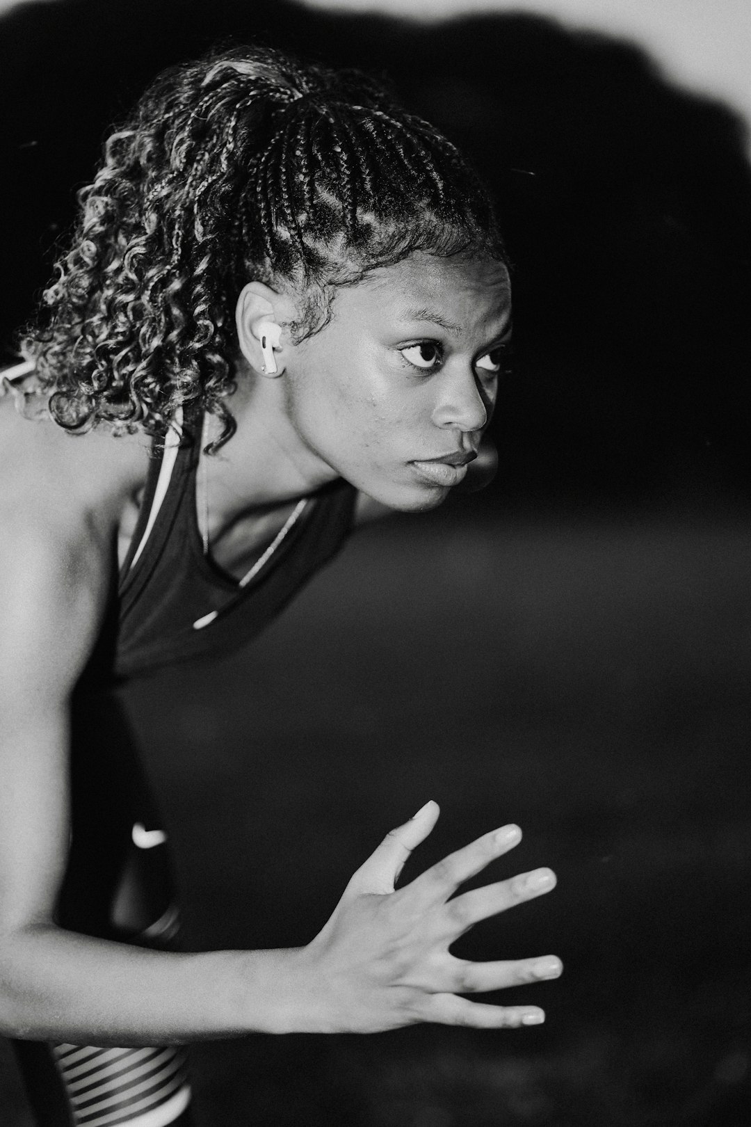 A woman holding a tennis racquet on top of a tennis court female athletes empowerment equality