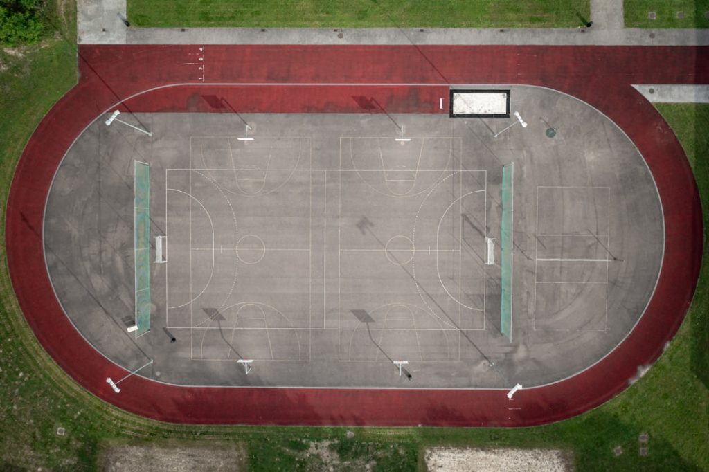 an aerial view of an empty basketball court girls sports high school track