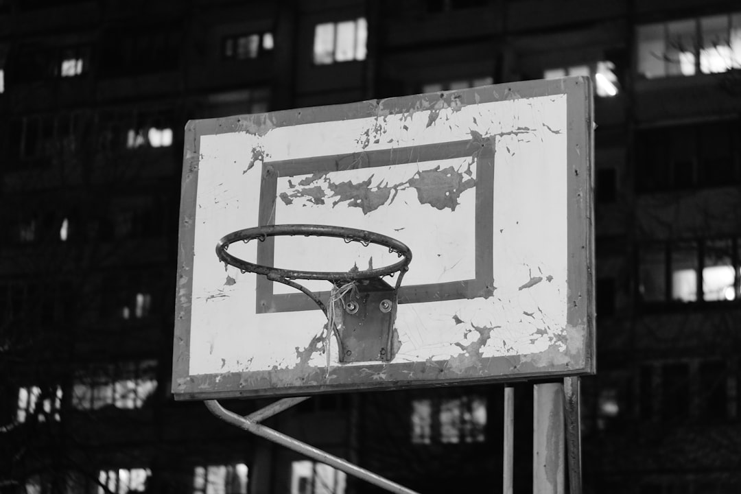 An old basketball hoop sits outdoors at night. willis reed, knicks vs lakers, 1970 nba finals, madison square garden