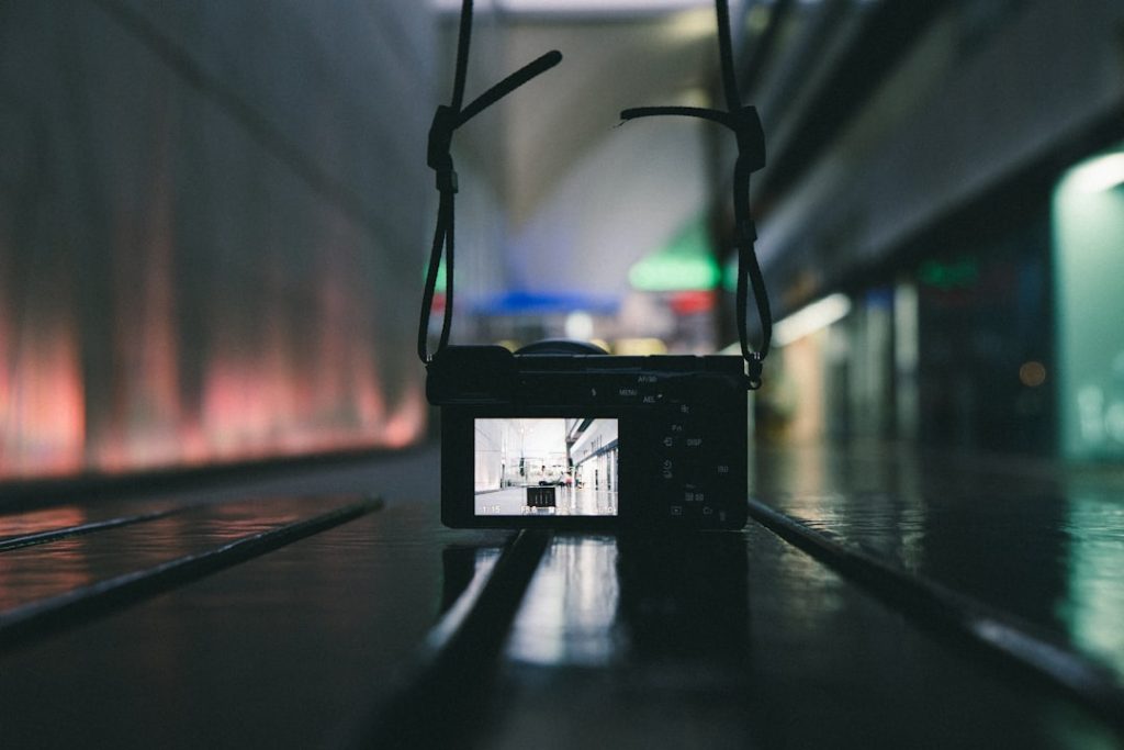 black camera on brown wooden table ambient video, silent vlog, digital detox