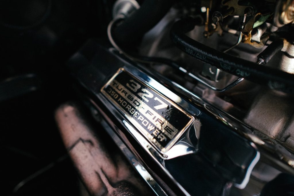Close up of a vintage 327 cubic inch v8 engine chevrolet, engine, mechanical failure