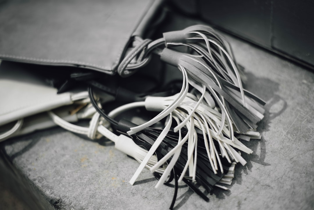grayscale photo of tassel hdmi cables, usb cords, ethernet wires