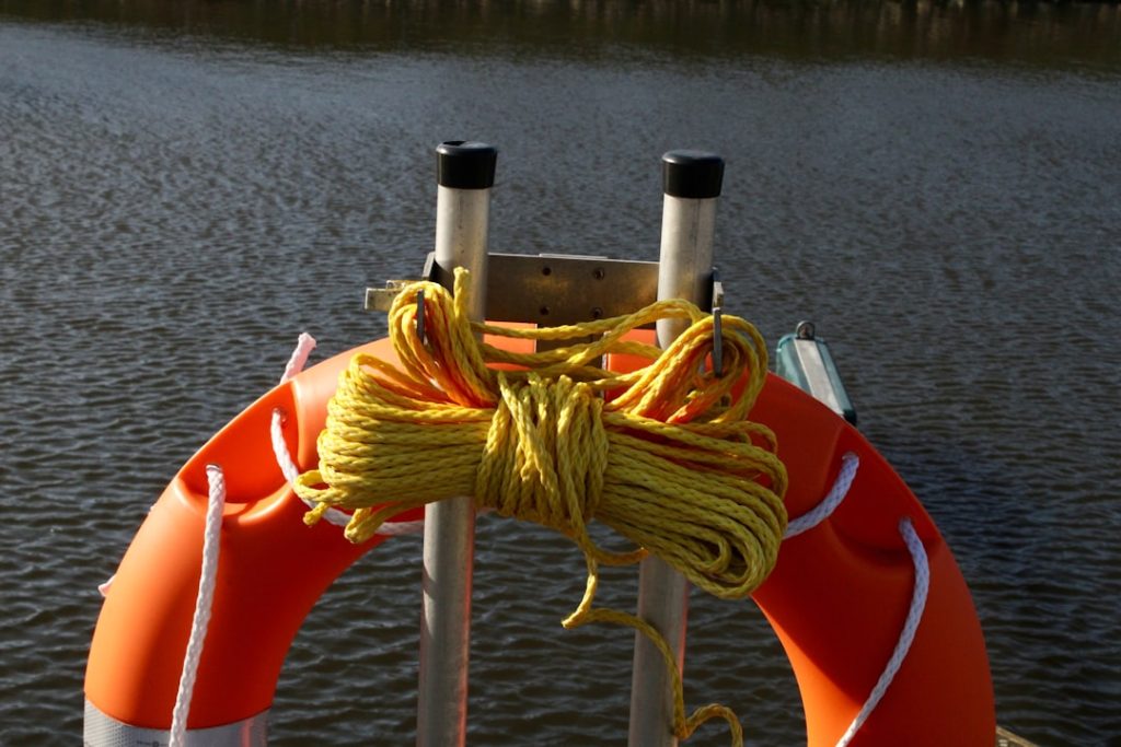 Life preserver with rope attached to a boat. water ski equipment life jacket tow rope beginner