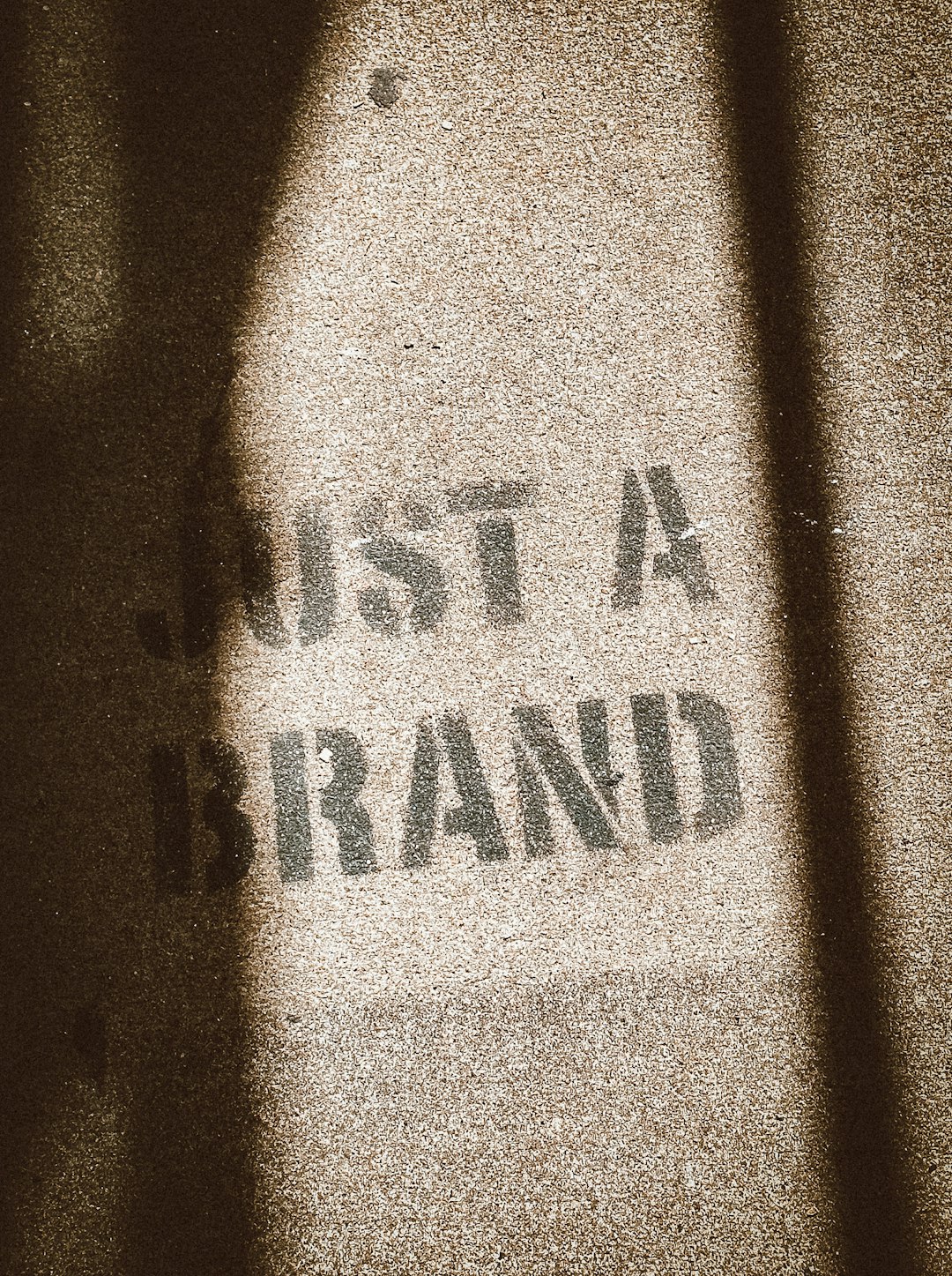 the shadow of a person standing in front of a sign enterprise saas, brand identity, logo maturity, business trust