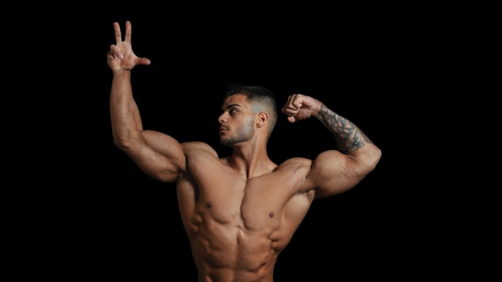 topless man with hands up bodybuilder, steroids, syringe