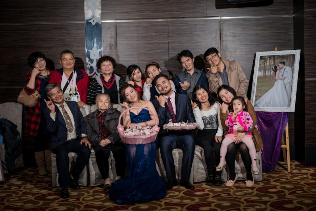 a group of people posing for a picture grace chang david chang family hugo couple