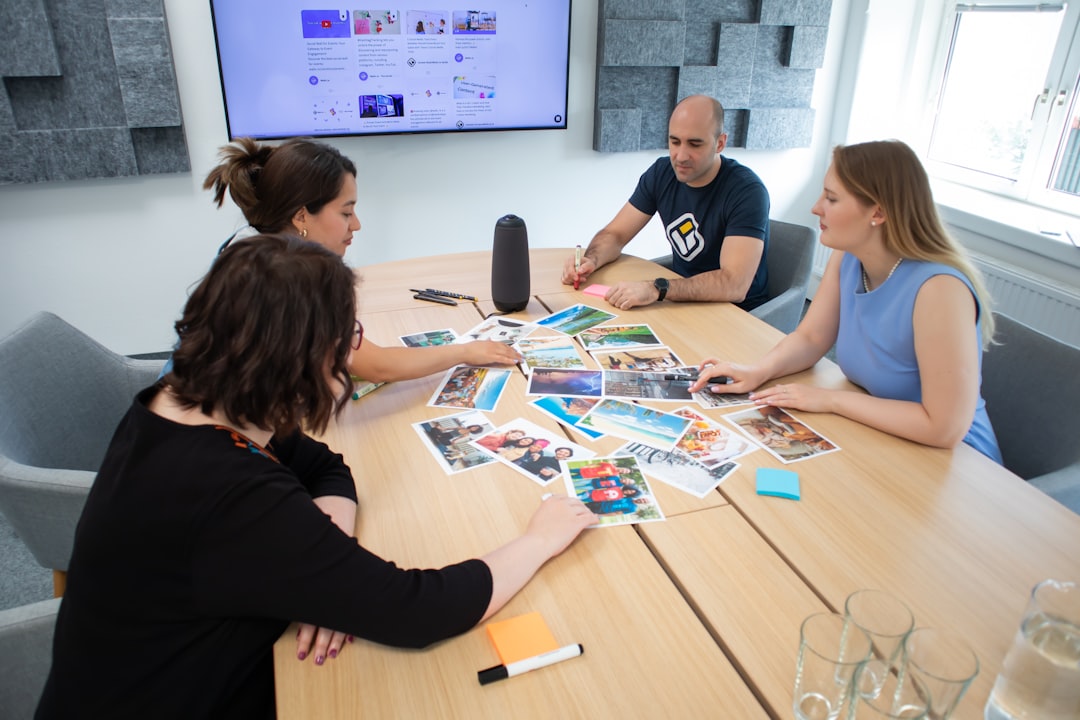 a group of people sitting around a wooden table community learning ai collaboration