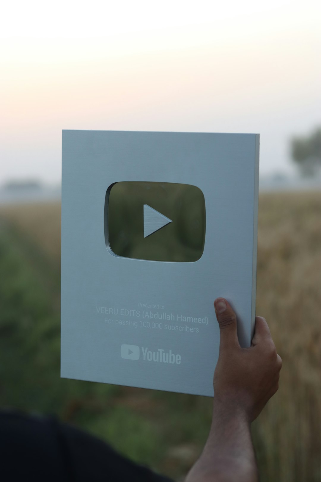 a hand holding a card diverse ad formats, video ads, social media carousel