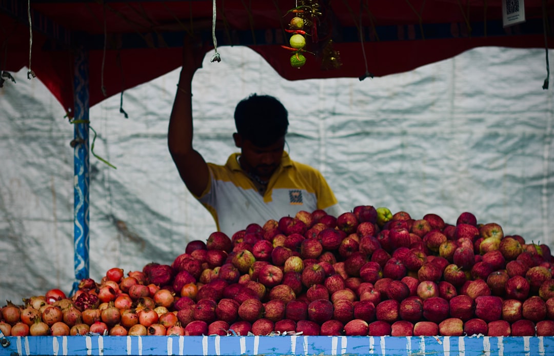 a person selling fruits apple factory, india workers, electronics assembly