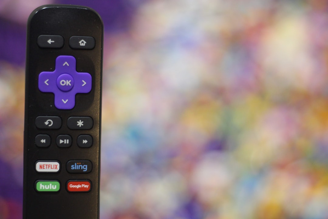 black remote control in close up photography streaming apps, 4k tv, remote control