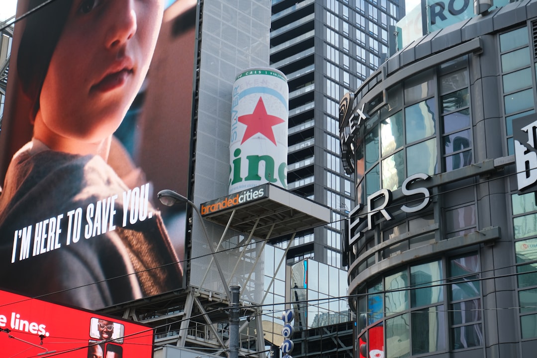 Heineken billboard in a cityscape. overused ads, digital screens, marketing fatigue
