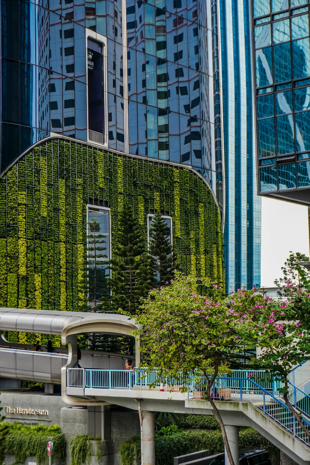 Modern buildings with green wall and trees environmental monitoring, smart city, sensors, air quality