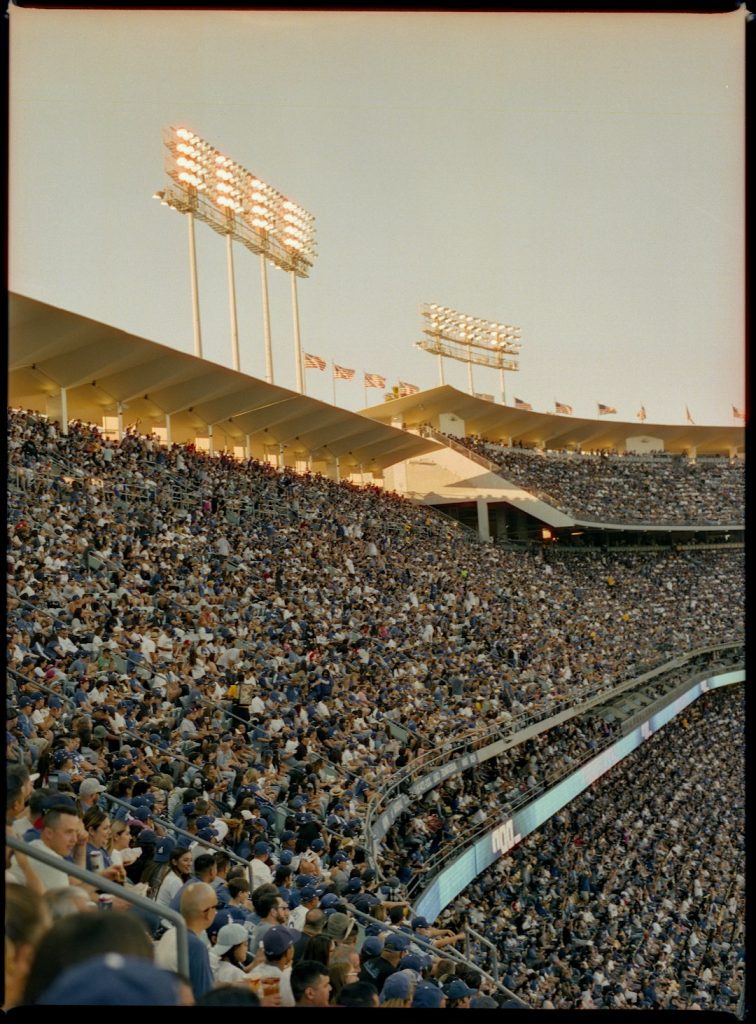 people sitting on stadium chairs during daytime dodgers marlins game night stadium crowd
