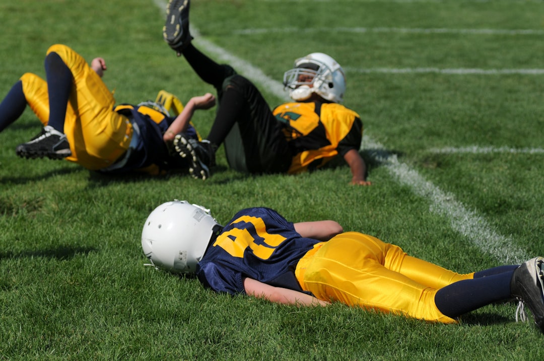 player lying on field joe burrow, micah parsons, nfl action
