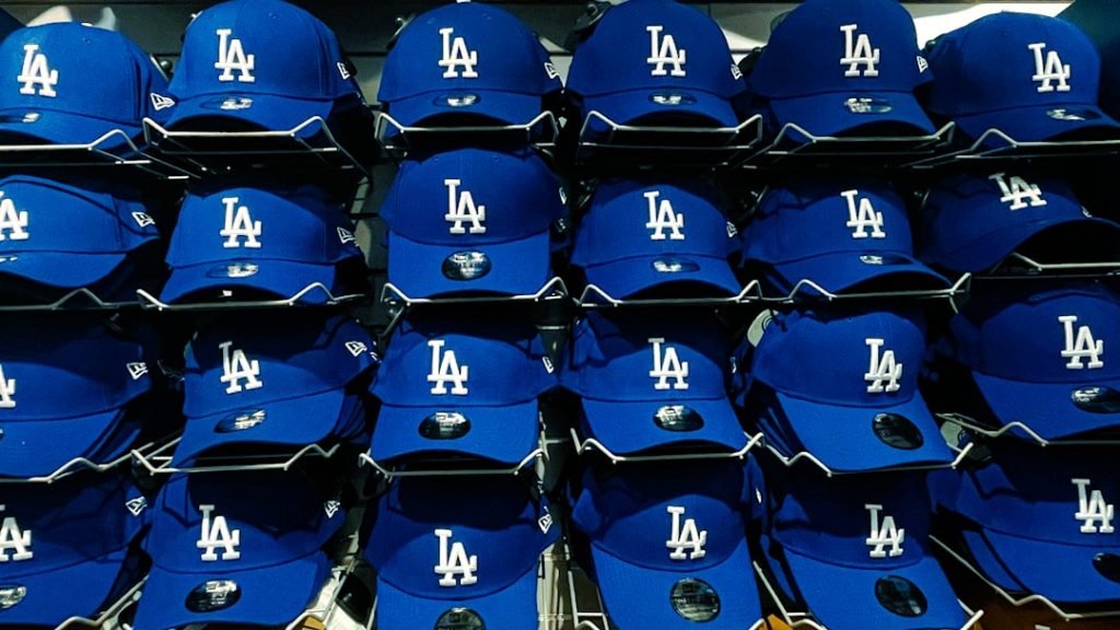 Rows of blue los angeles dodgers baseball caps dodgers marlins game night stadium crowd